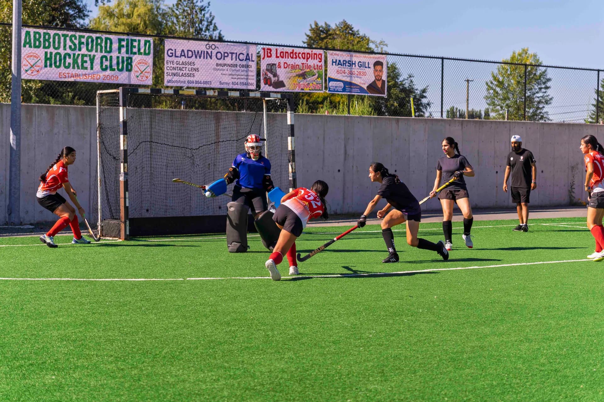 AFHC players competing on the field hockey pitch in Abbotsford, BC