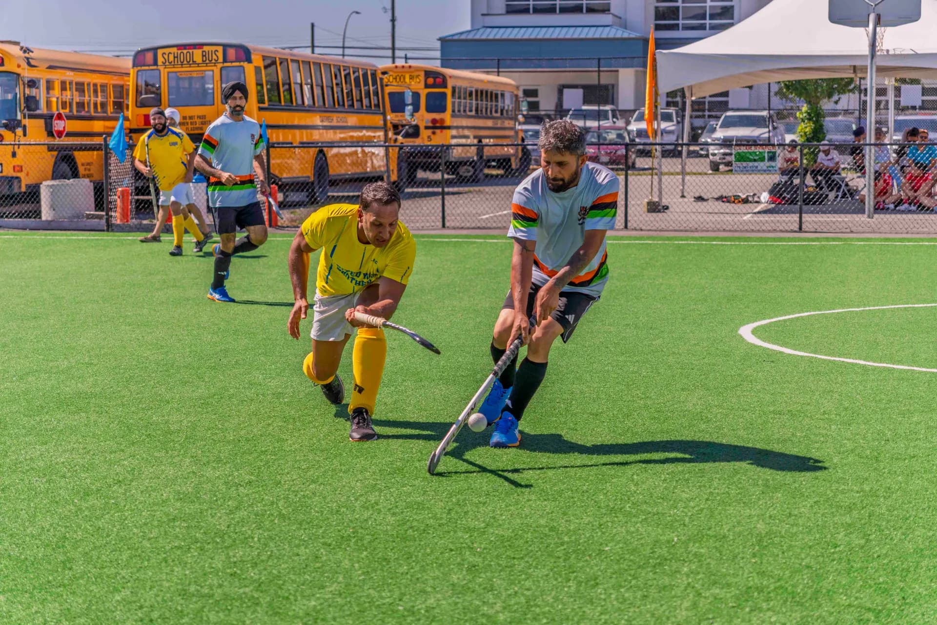 AFHC coaches and members at the Abbotsford field hockey pitch