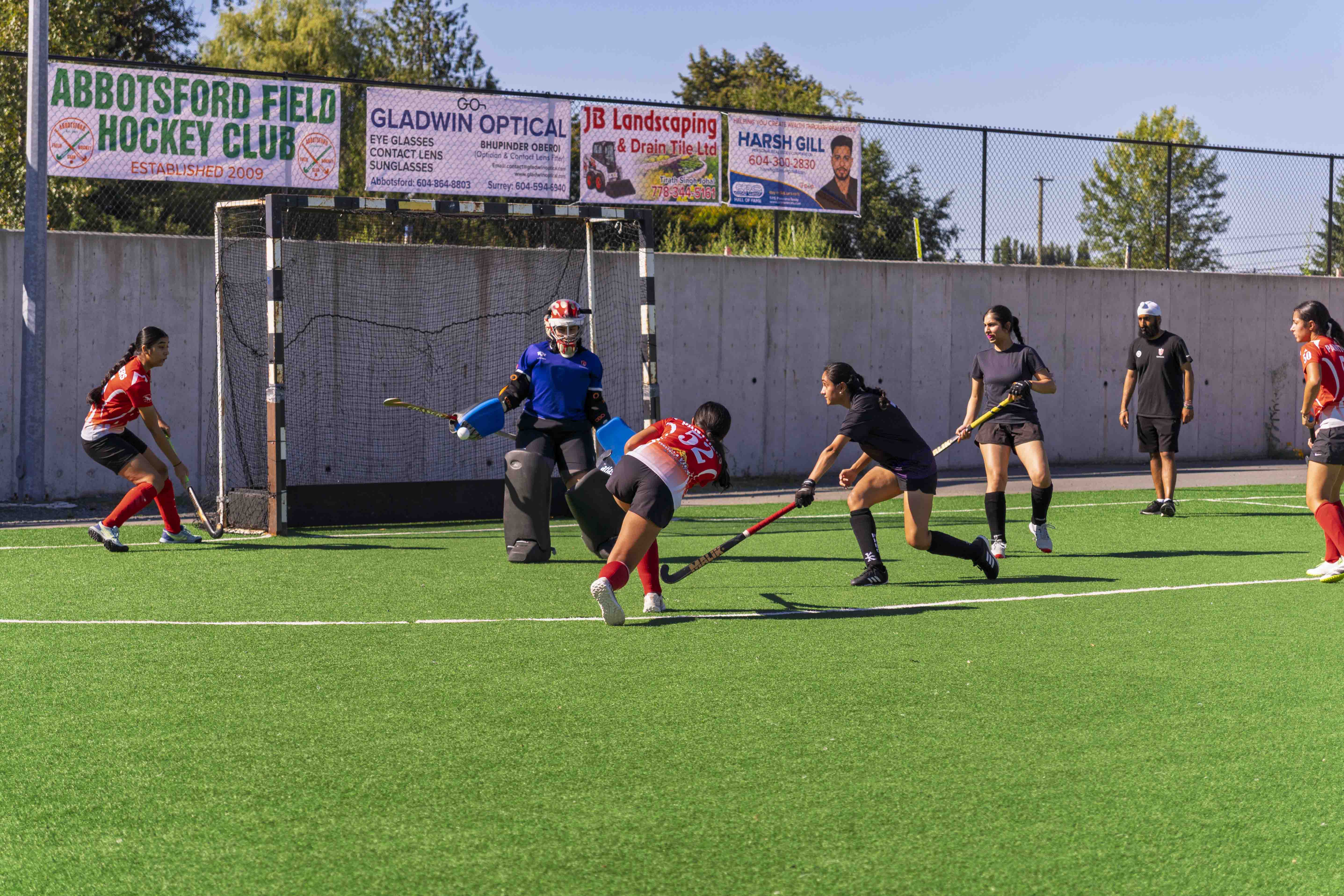 AFHC players competing on the field hockey pitch in Abbotsford, BC