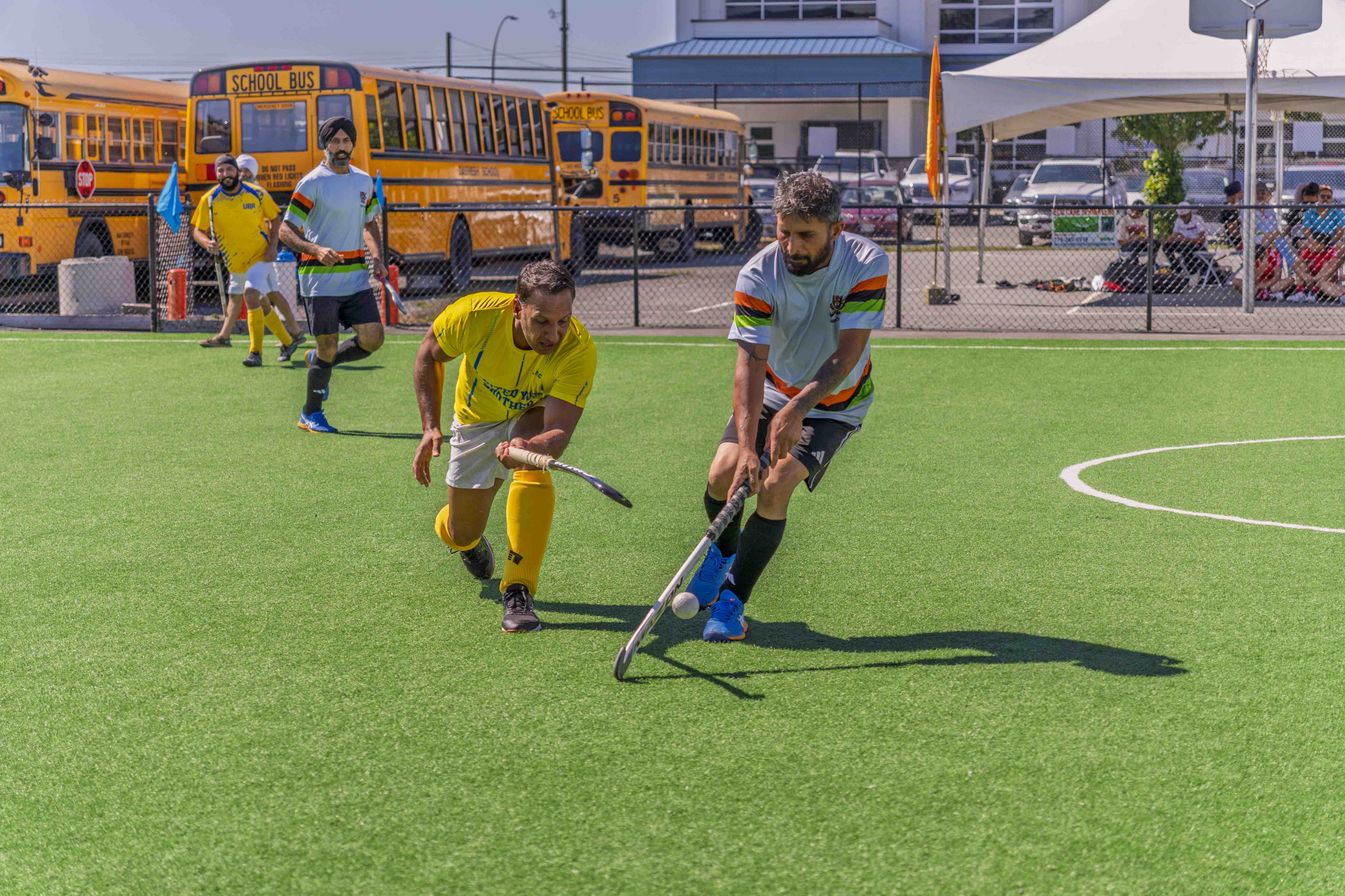 AFHC coaches and members at the Abbotsford field hockey pitch