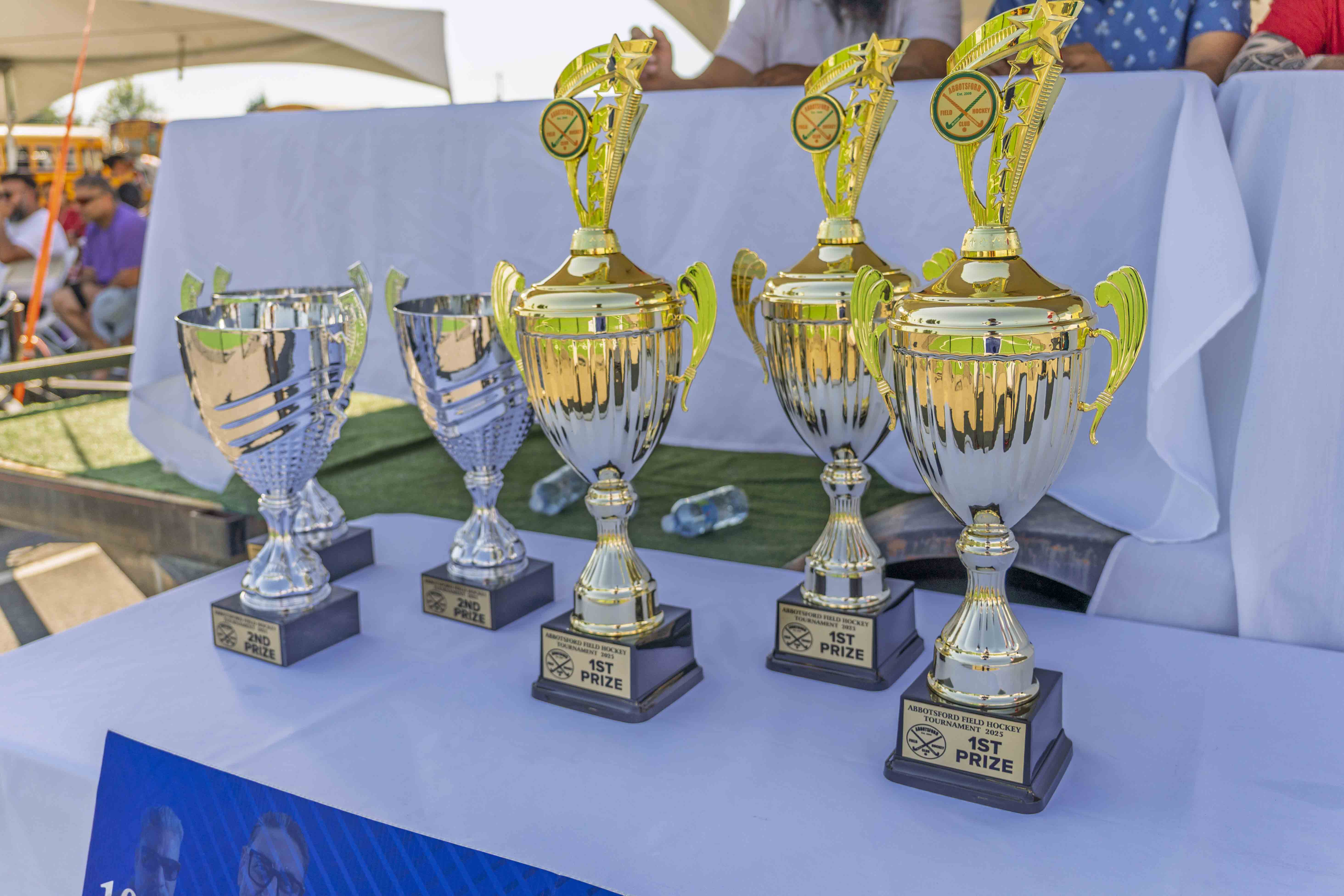 Championship trophies on display at an AFHC field hockey tournament